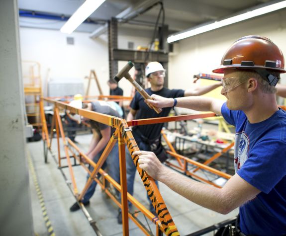 students working on bridge construction